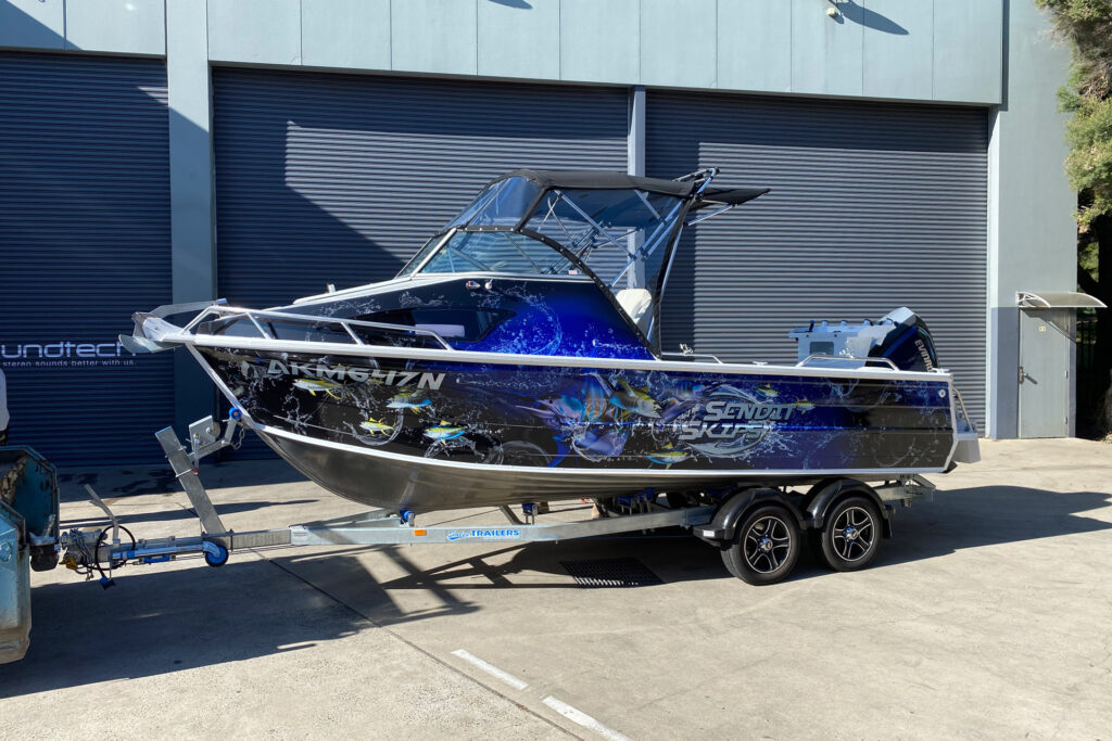 Fishing Boat Wrapped by Vinyl Film. Work of Marine Wrap Solutions